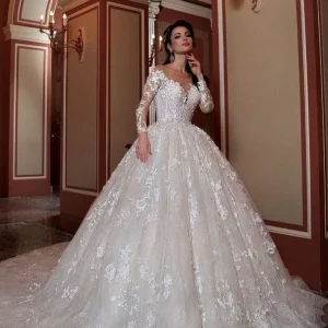 Elegant Bateau Long Sleeve Beaded A-Line Lace Wedding Gown with Chapel Train